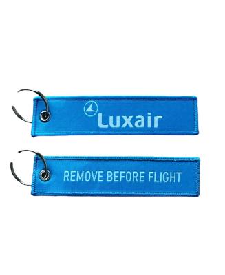 Porte-clé Luxair bleu clair couleur de la compagnie